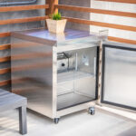 An image of a mini silver fridge in the cabana in the bottom corner,
